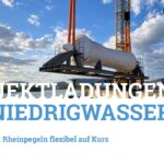 Schwere Projektladung wird am Birsterminal in ein Binnenschiff verladen